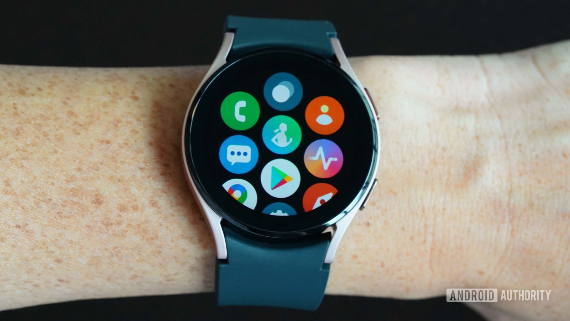 Samsung Galaxy Watch 4 displays app screen on a black background.