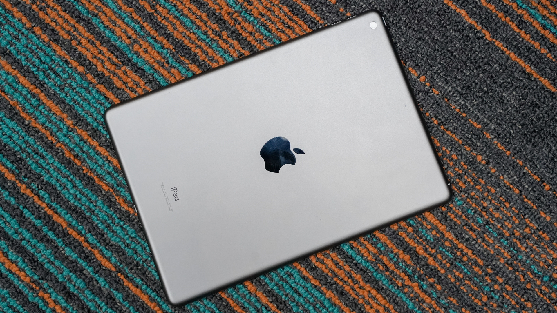 Apple iPad 2021 rear panel angled in carpet