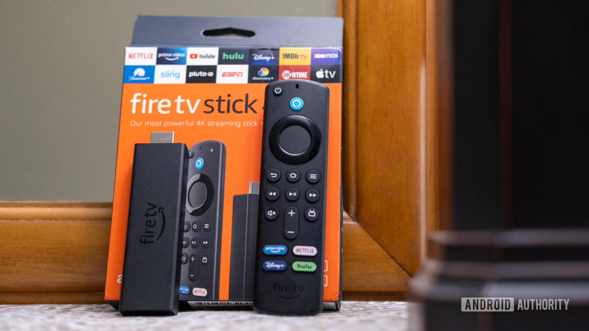 The Fire TV Stick 4K Max and remote leaning on the box
