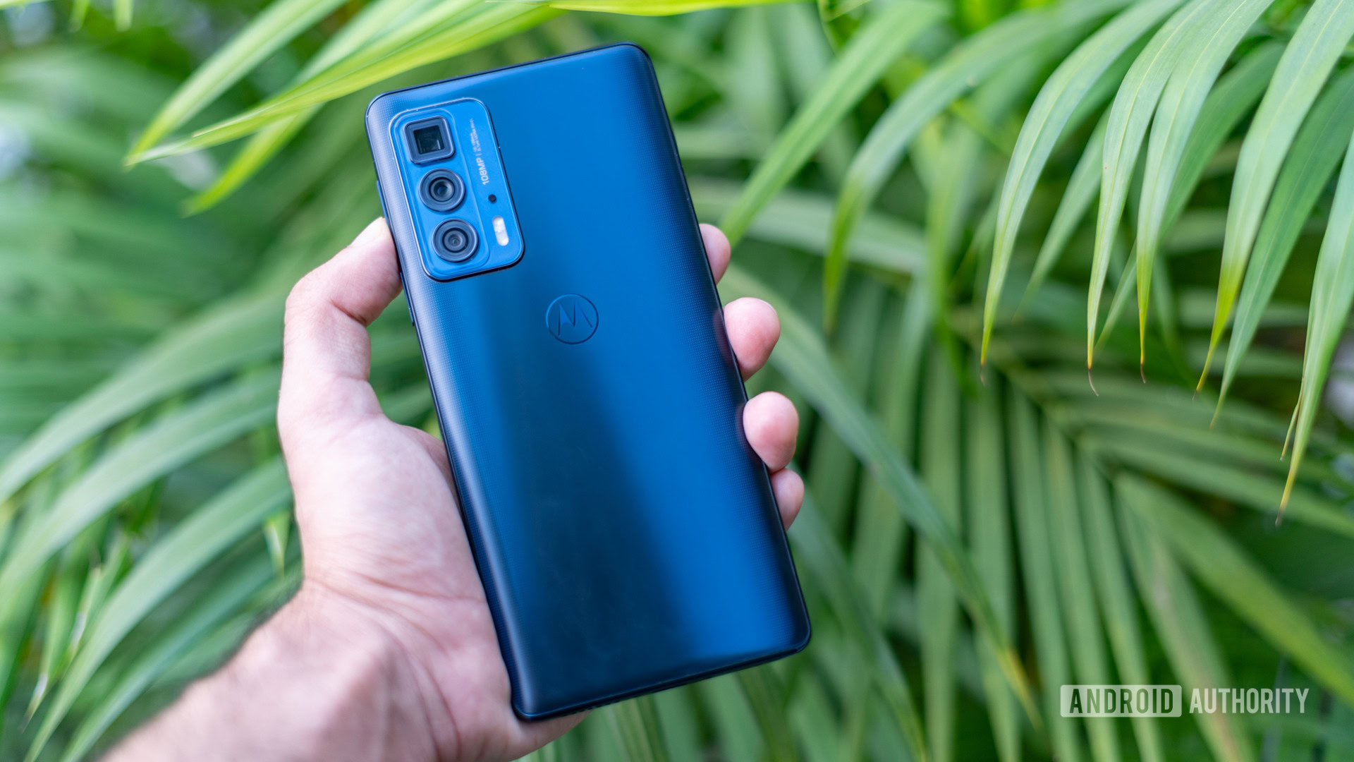 Moto Edge 20 Pro back of the phone in hand outdoors