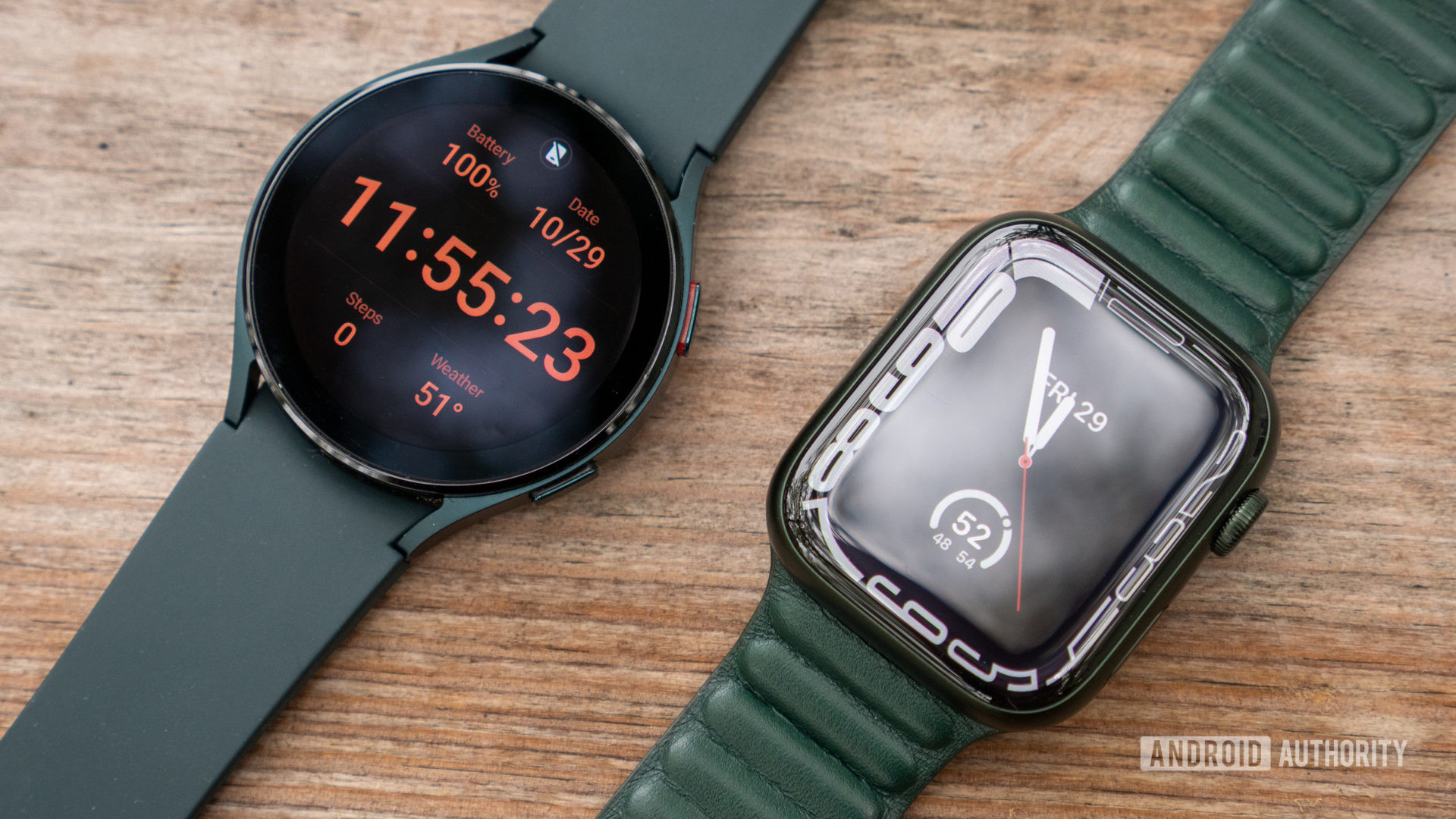 Apple watch series 7 vs samsung galaxy watch 4 display watch face on table 1