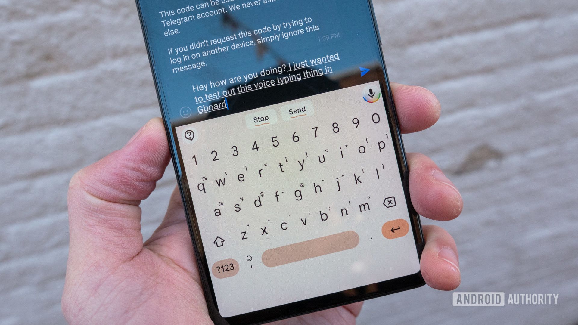 The Google Pixel 6 in hand showing gboard voice typing