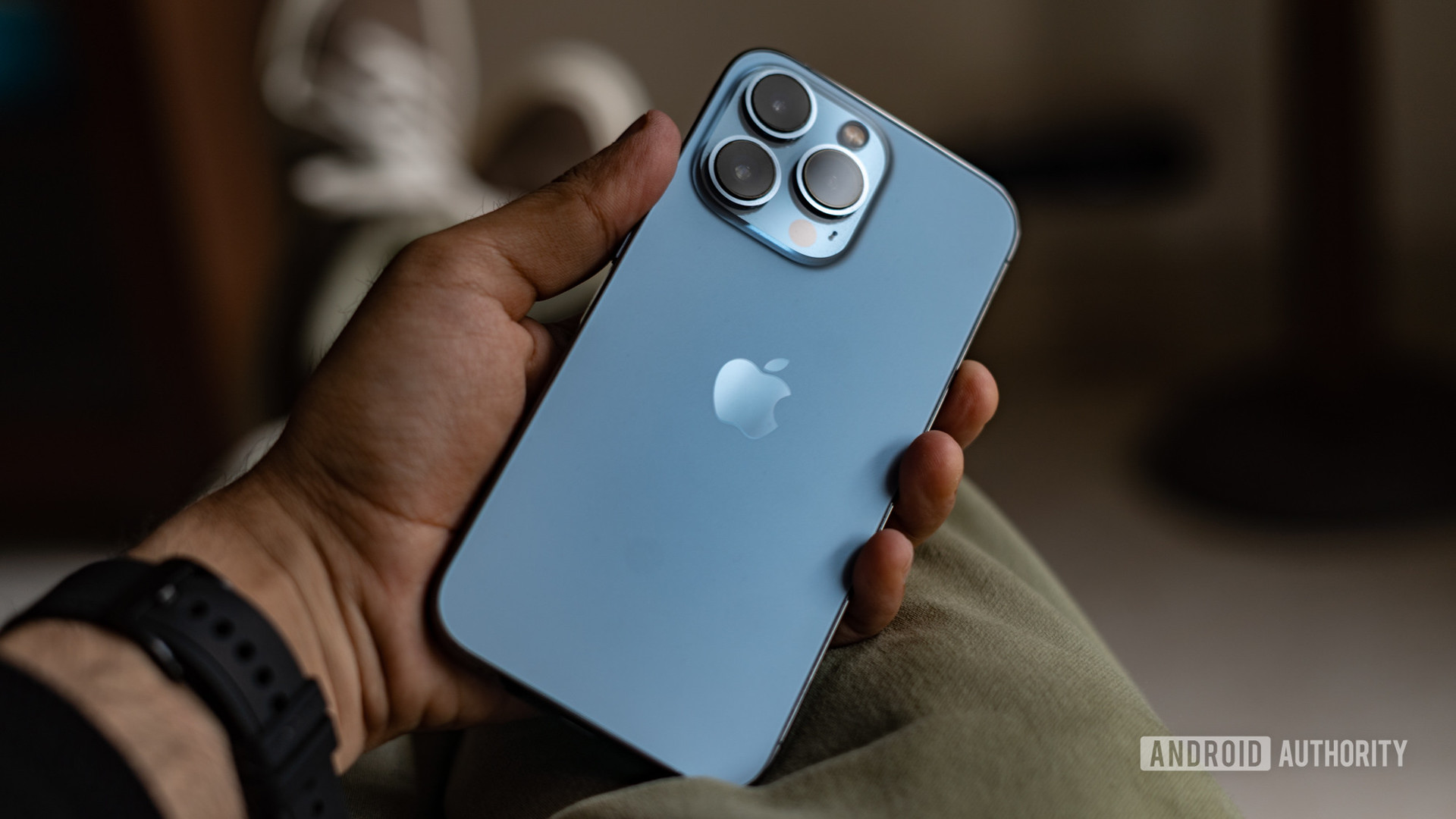 iPhone 13 Pro review in hand showing camera