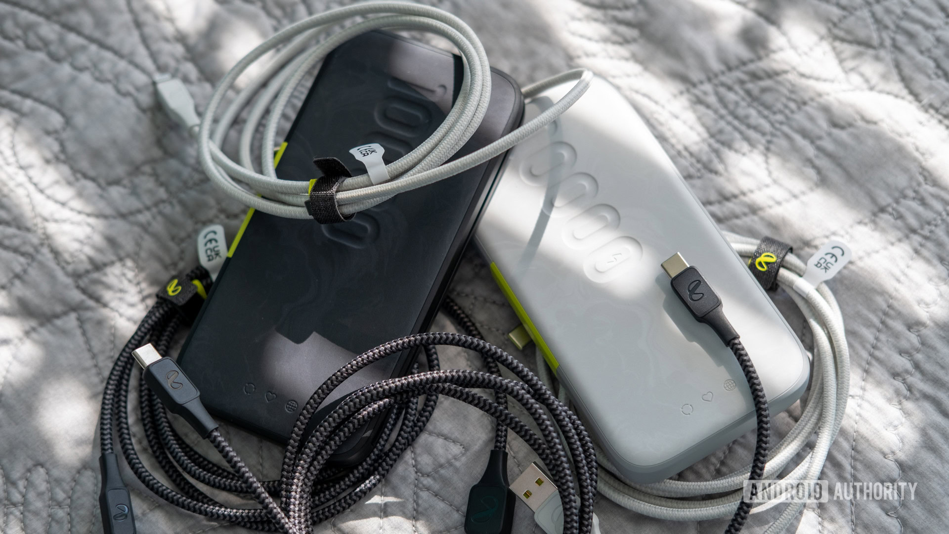InfinityLab InstantGo power banks surrounded by charging cables