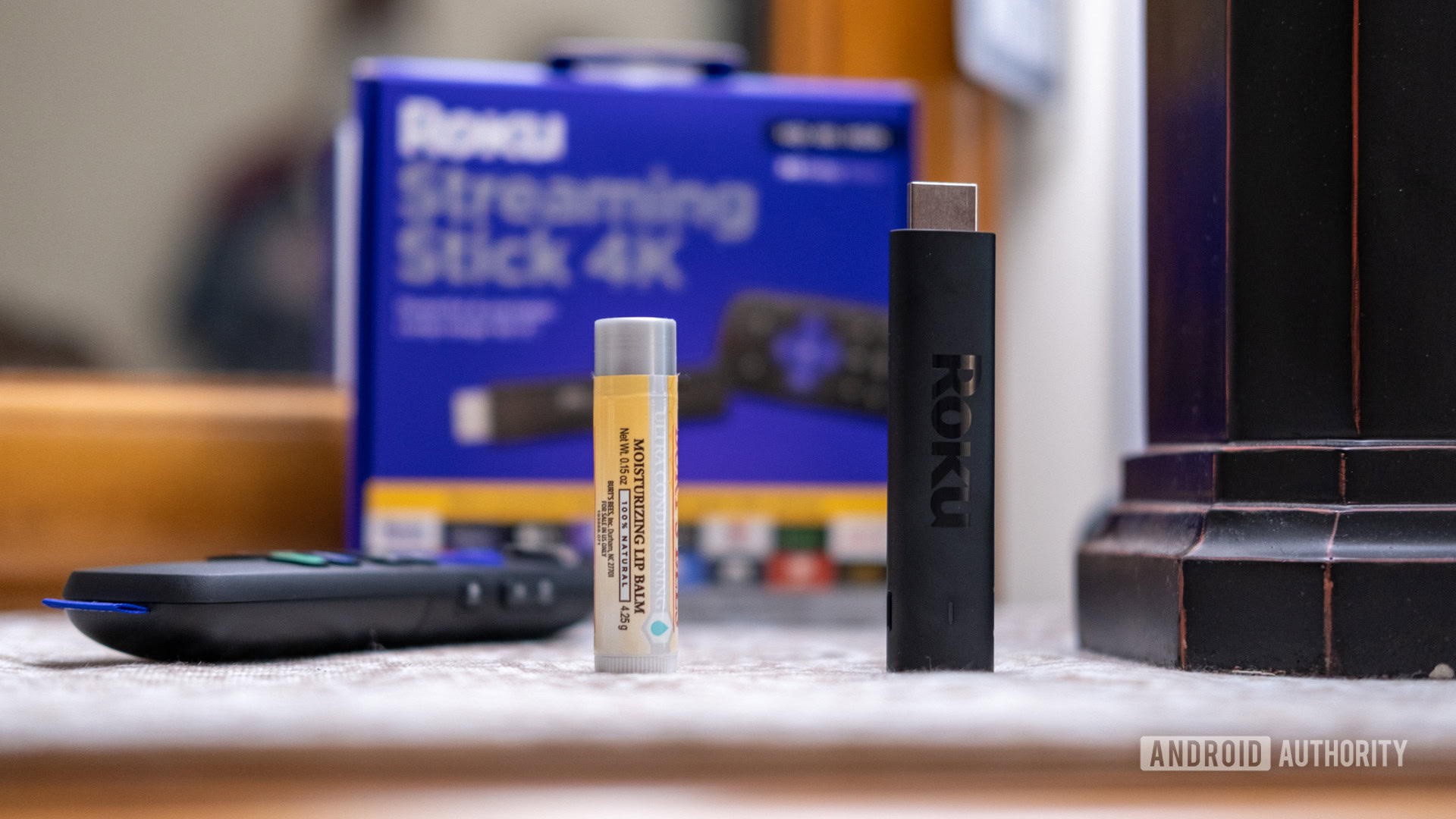 The Roku Streaming Stick 4K next to lip balm for scale