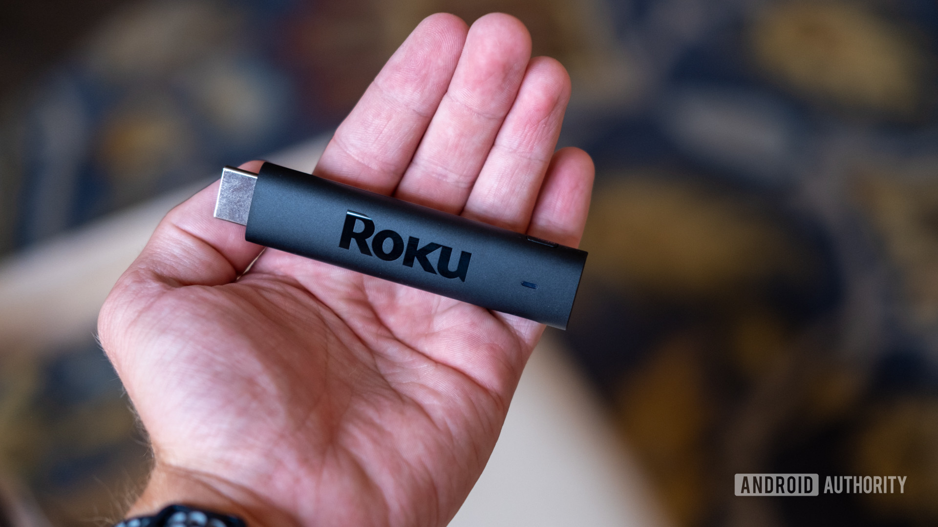 The Roku Streaming Stick 4K in hand