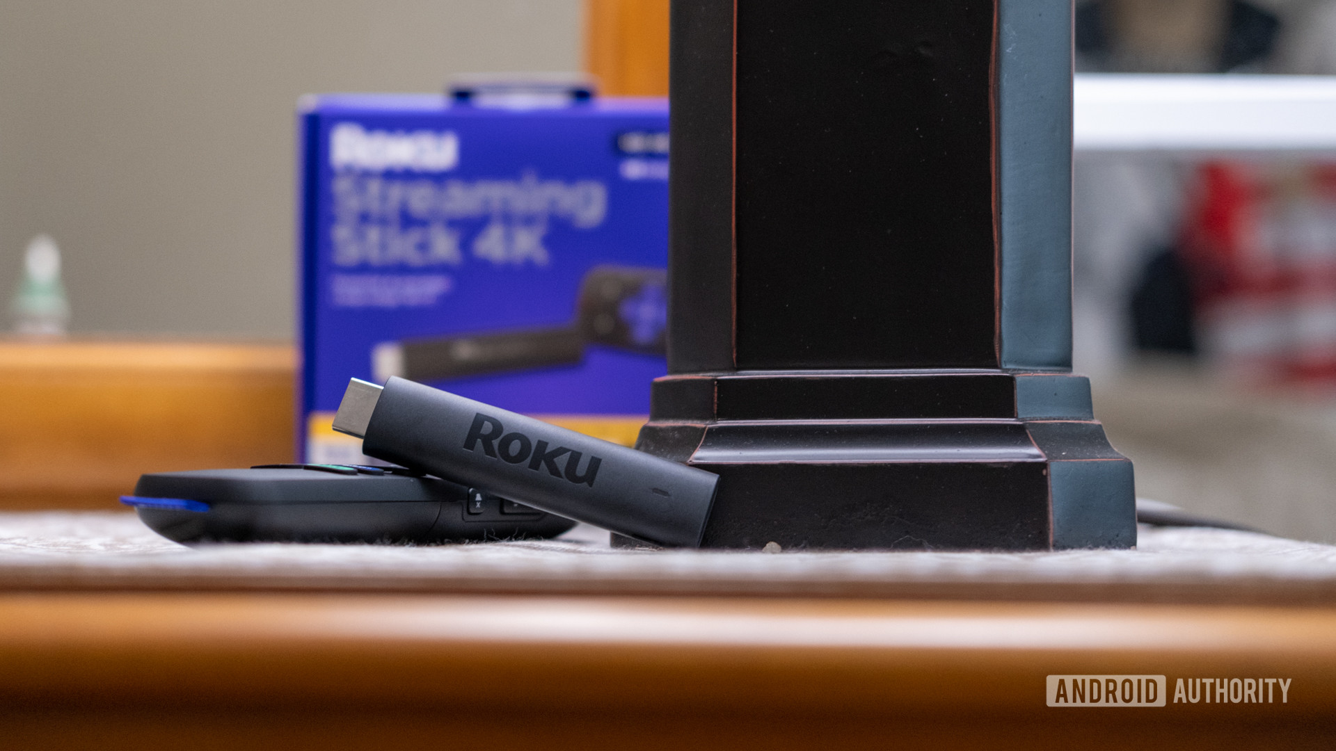 roku streaming stick 4k on remote in front of box