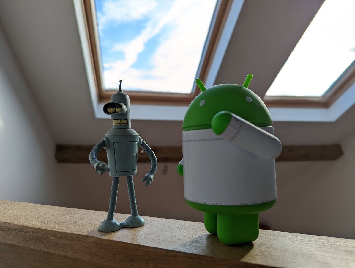 Camera sample HDR shot of two figurines in front of a window on the Google Pixel 6 Pro