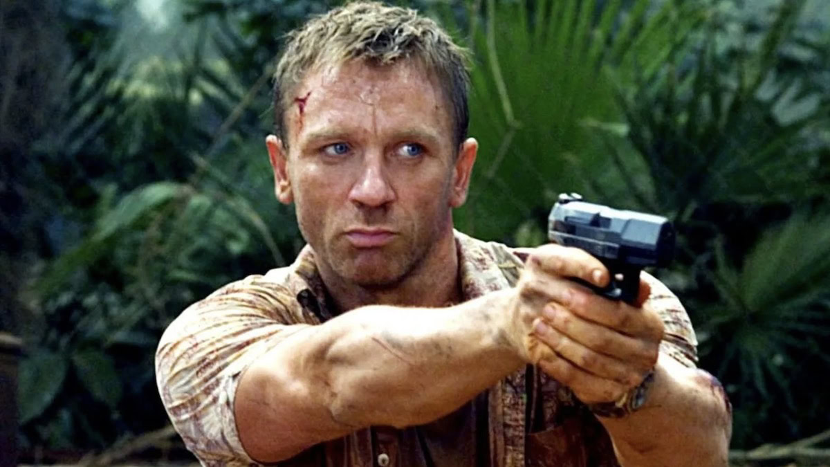 Daniel Craig as Bond in Casino Royale, pointing a gun in the jungle.