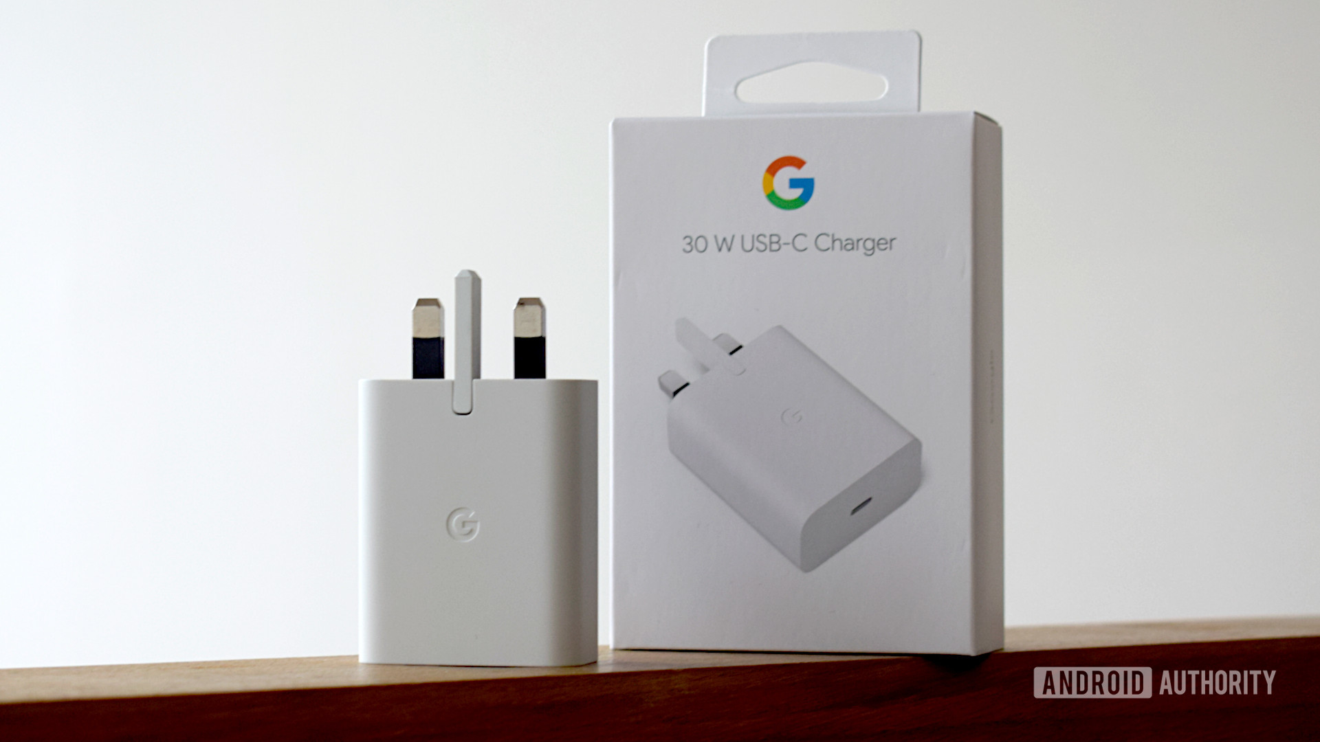 Google 30W USB C Power Charger upright next to box