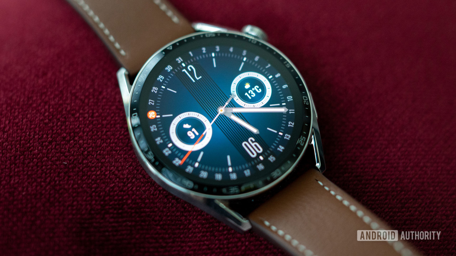 Huawei Watch GT 3 review watchface on red background