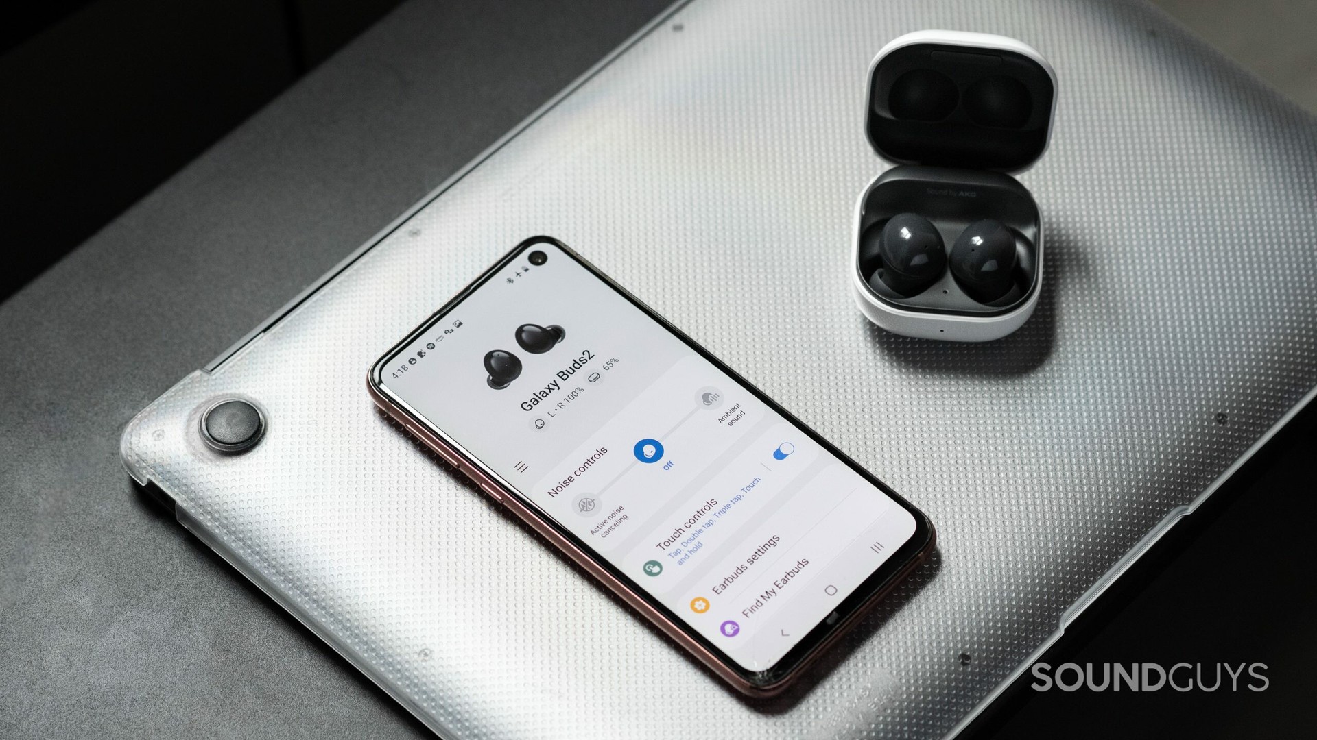 Samsung Galaxy Buds 2 noise cancelling true wireless earbuds next to phone