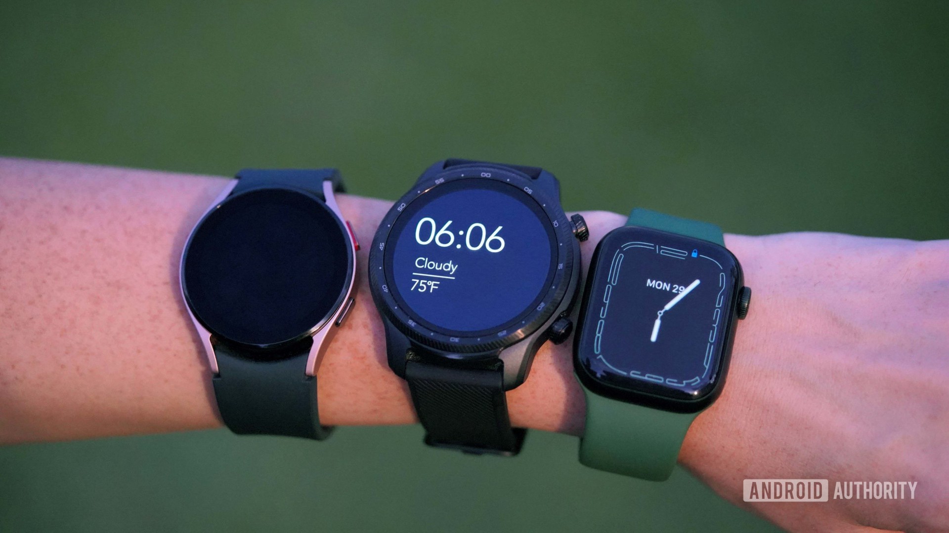 A woman wears multiple competitors from the smartwatch market.