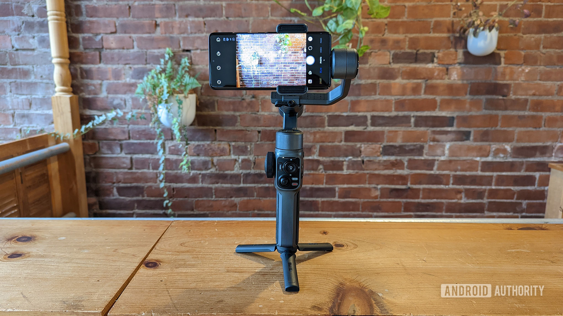 Zhiyun Smooth 5 Review Gimbal Propped with Smartphone In Clamp