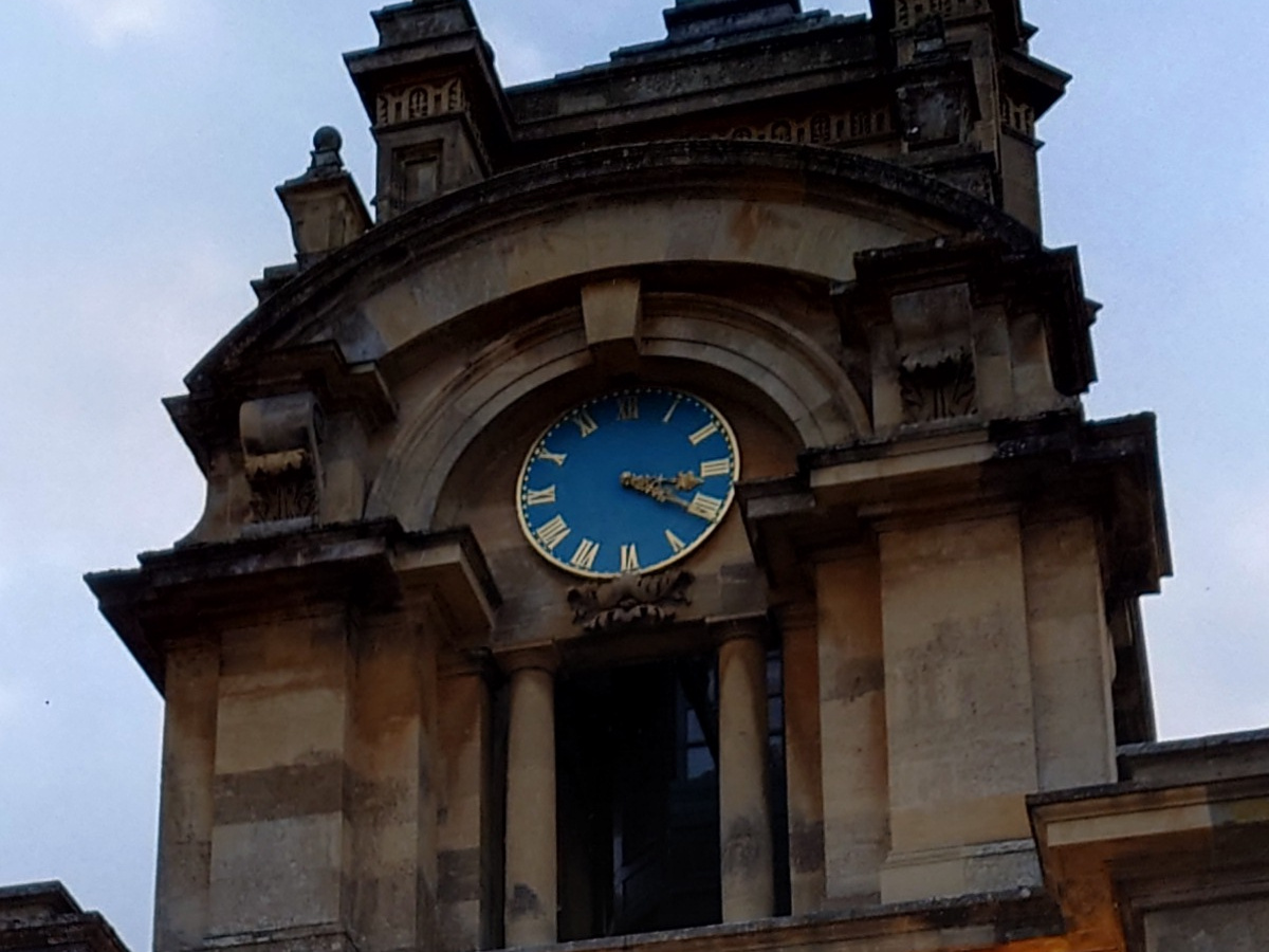 Crop of stone clock tower with blue clock shot on Sony Xperia 1 III
