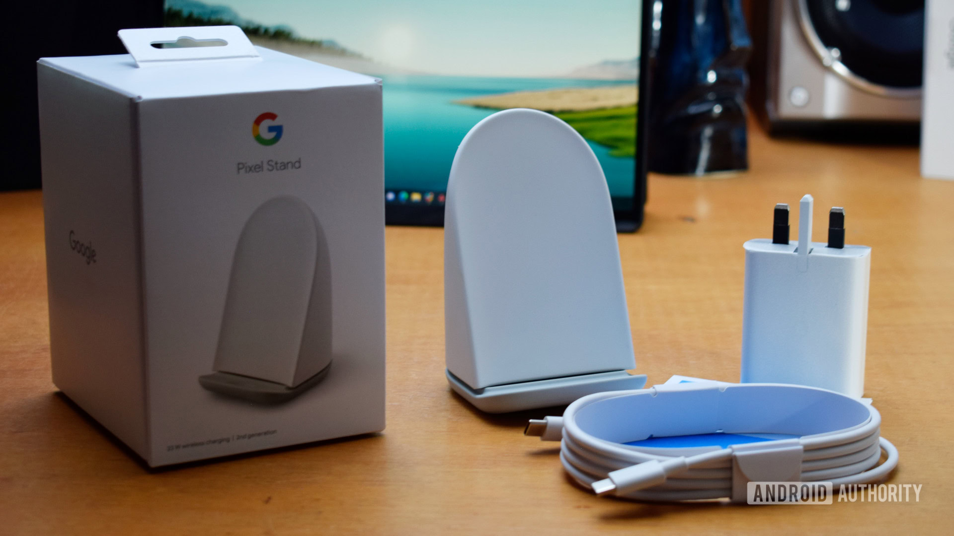 Contents of Google Pixel Stand box on wooden table