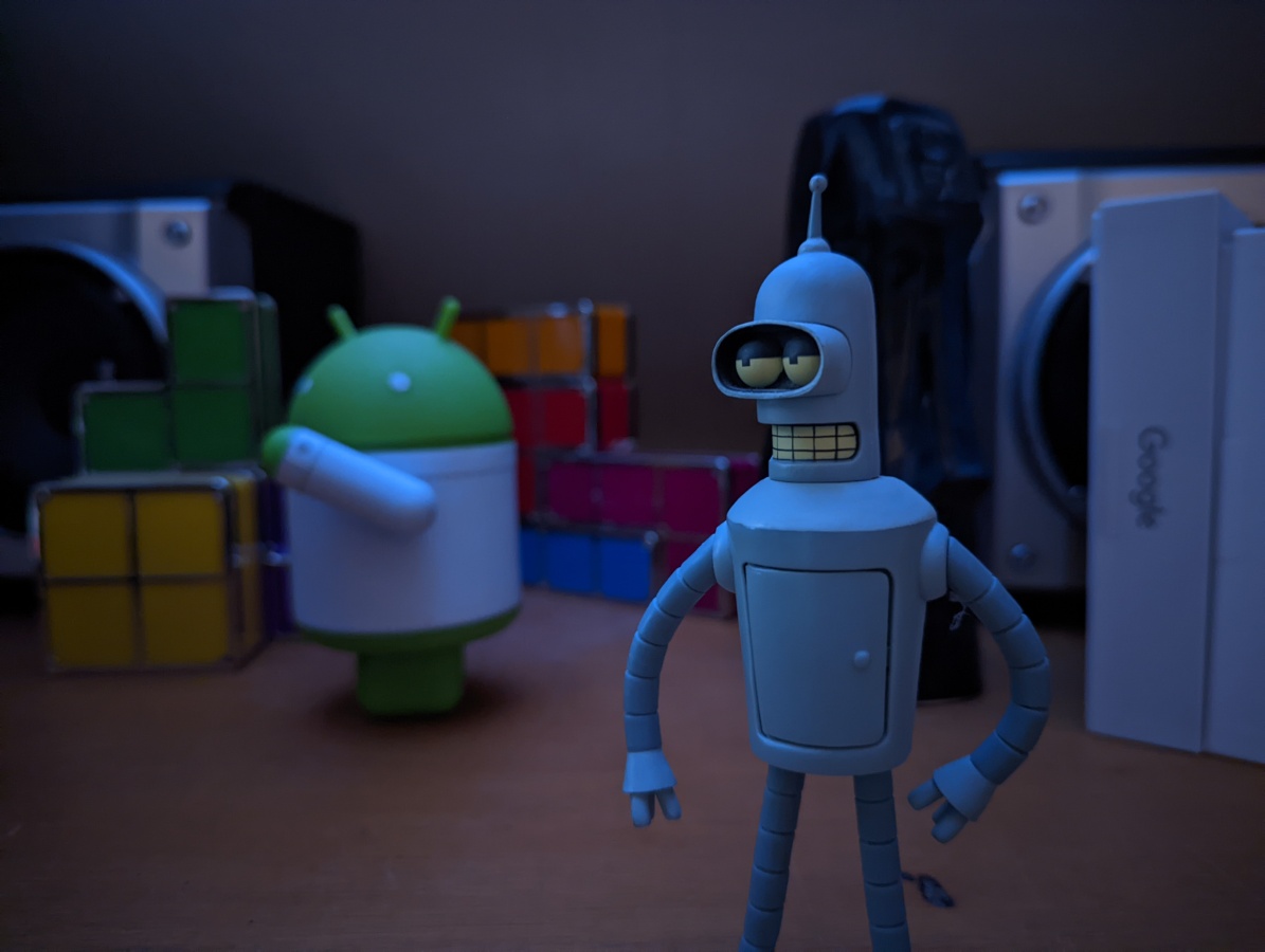 Figurines and Tetris lights in the dark shot on Google Pixel 6 Pro