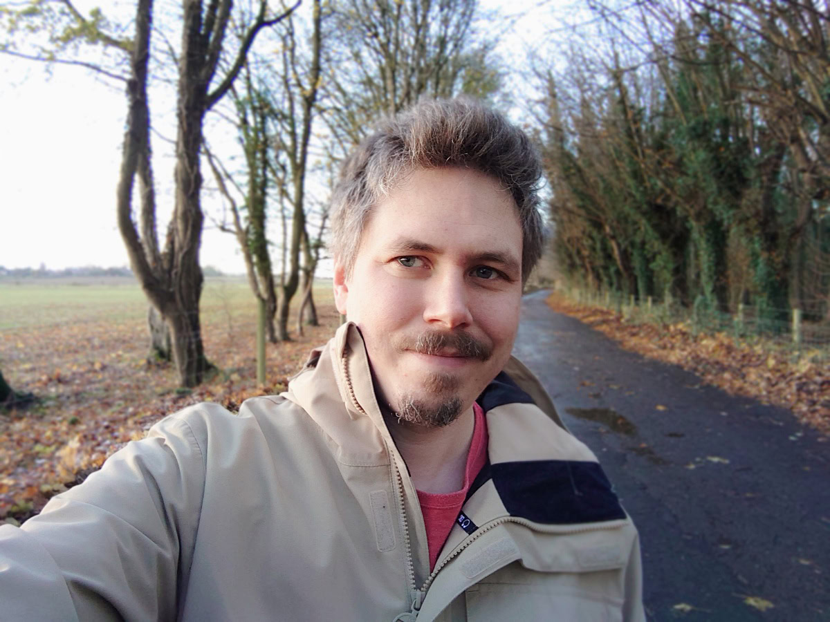 Outdoor selfie on a cold day with trees in the background shot on Sony Xperia 1 III