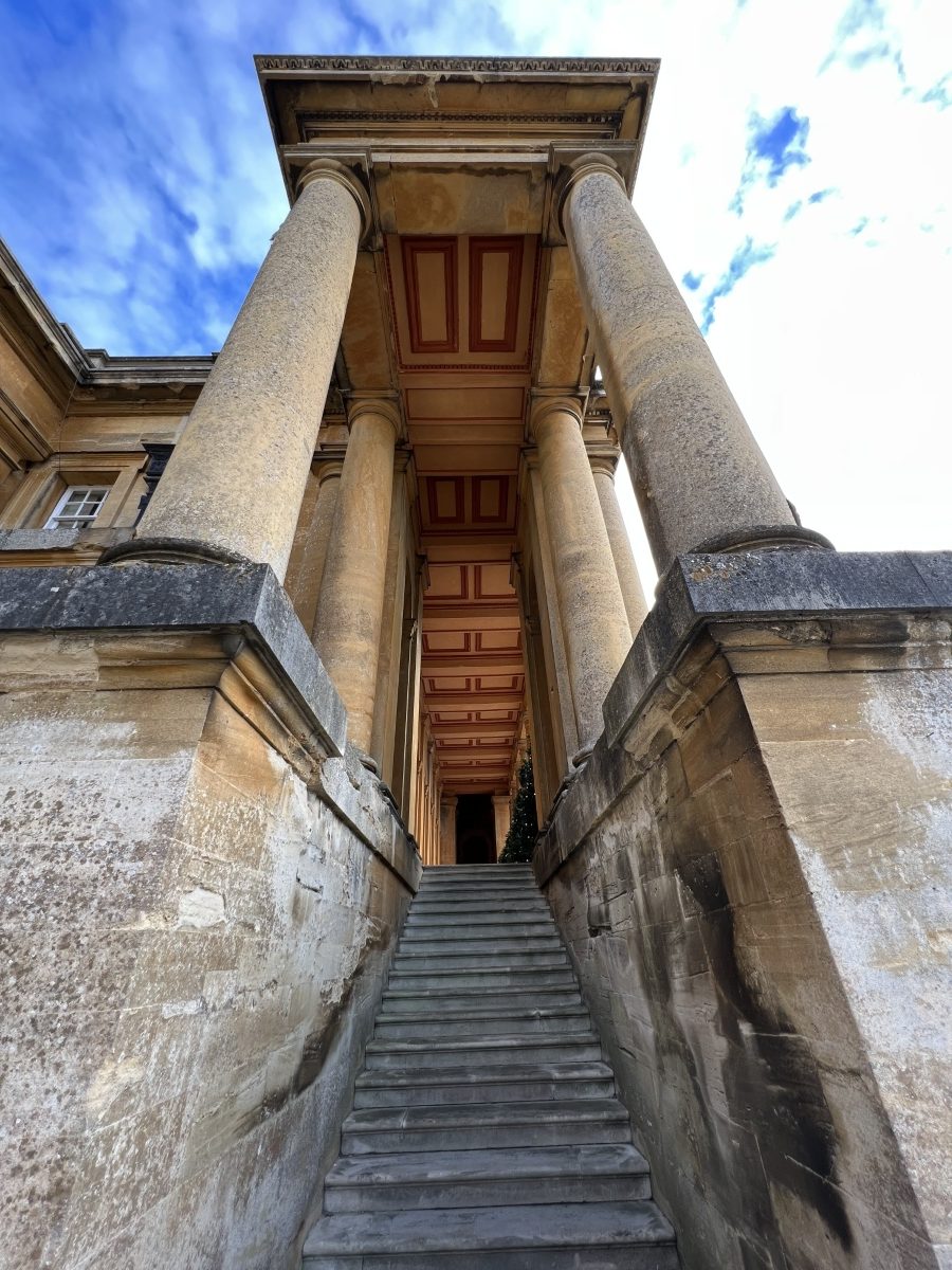 Wide-angle picture of stone pillars and stairs on a cloudy blue sky shot on Apple iPhone 13 Pro Max