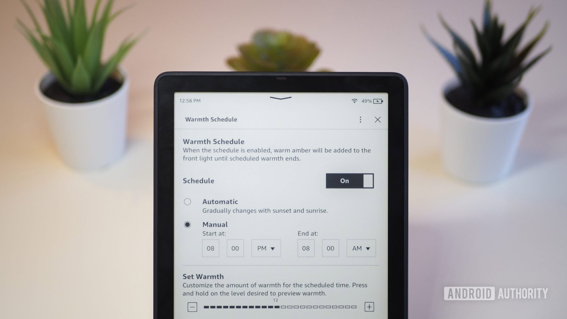 Amazon Kindle Paperwhite 2021 with the screen showing the display warmth temperature settings