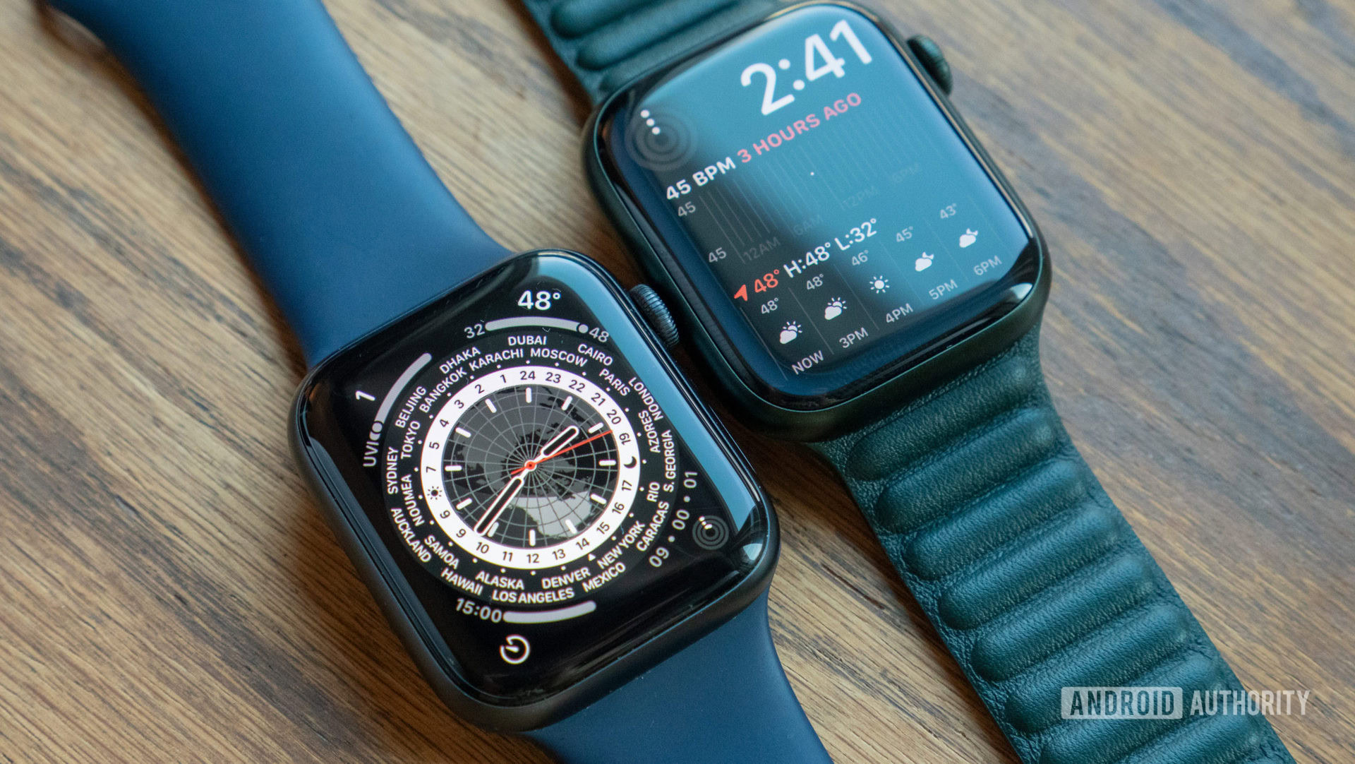 An image of the Apple Watch Series 6 and Series 7 laying on a table showing their watch faces
