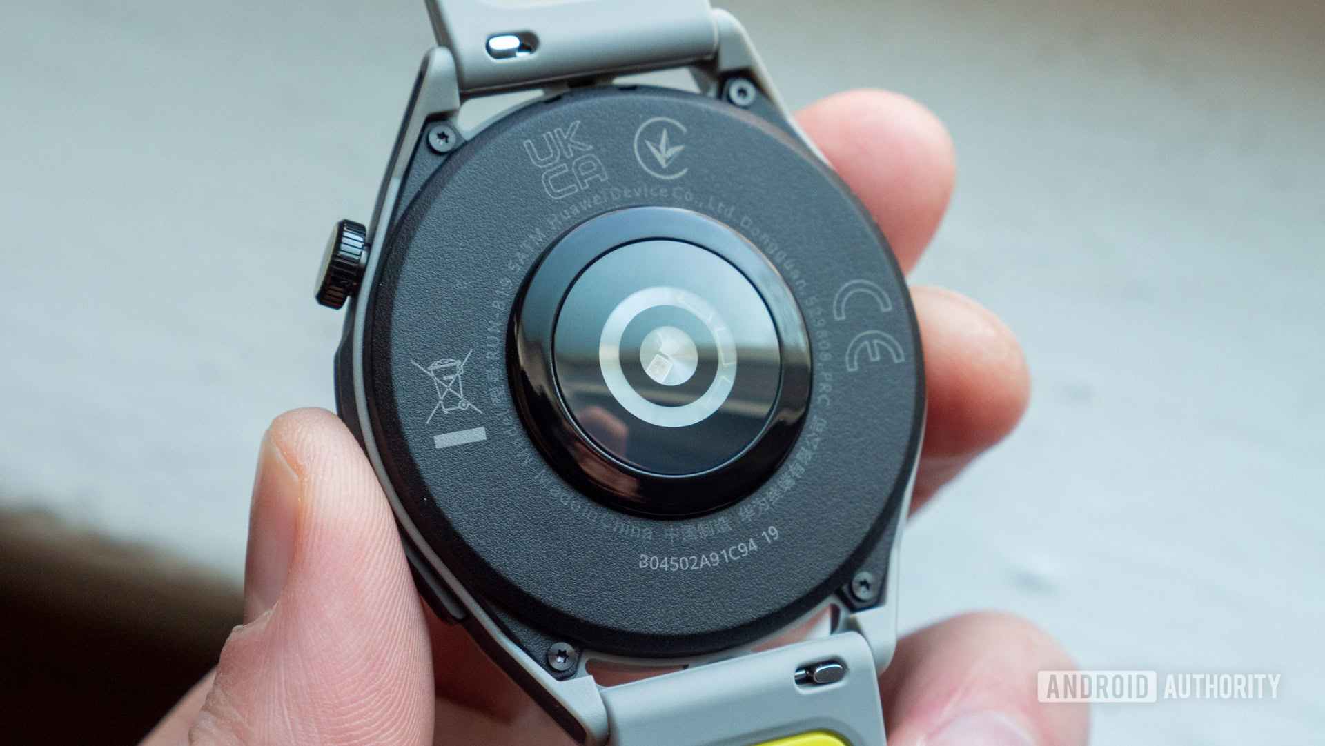 Huawei Watch GT Runner in hand heart rate sensor