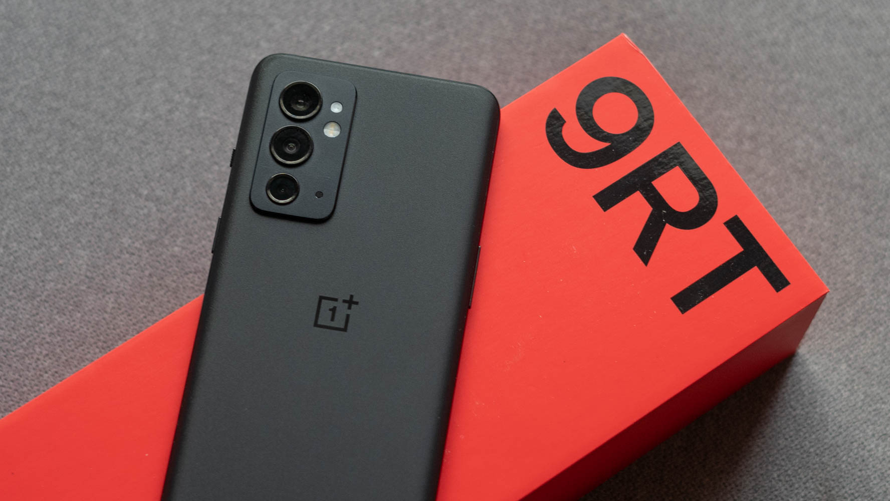 OnePlus 9RT showing back of the phone on a box