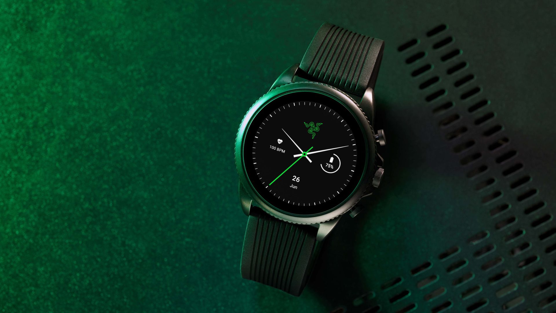 A Razer X Fossil Gen 6 sits on a black industrial surface with green lighting.